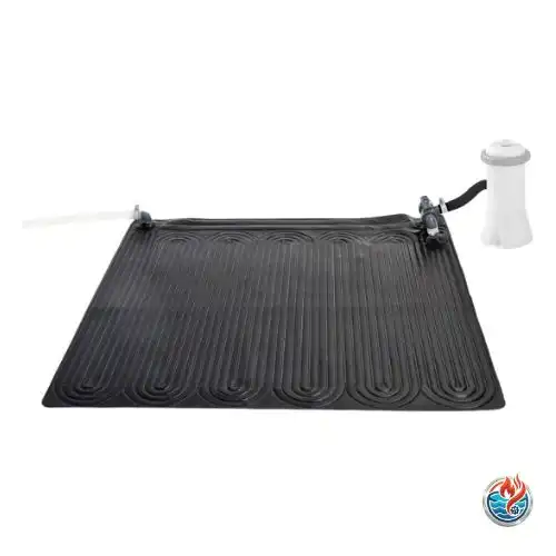 A rectangular black solar pool heating mat with a winding tube pattern is shown on a white background. On the right, it is connected by hoses to a white cylindrical pool filter pump. On the left, a clear hose extends outward.